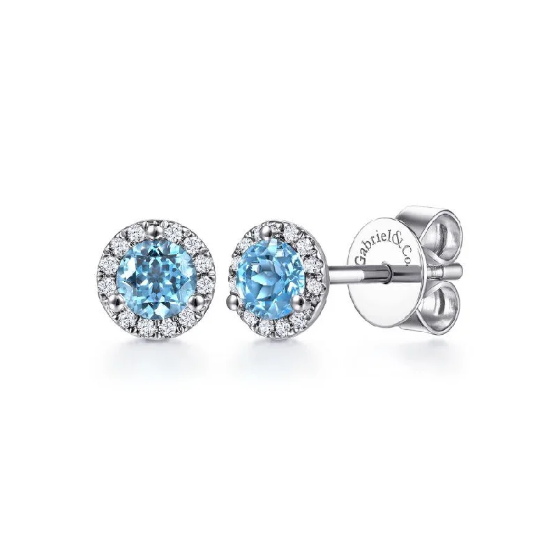 Ladies quiet charm earrings -Gabriel & Co. - EG12372W45BT - 14K White Gold Round Cut Diamond Halo & Swiss Blue Topaz Stud Earrings