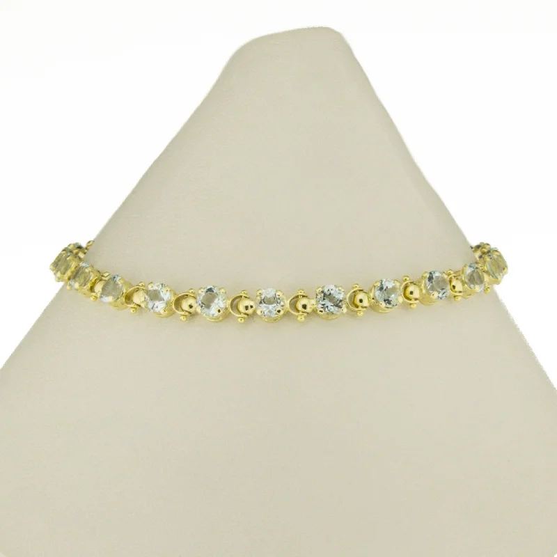 ladies silver bracelets sapphire stones -4.64ctw Round Aquamarine Accented Tennis Link 7.5" Bracelet in 14K Yellow Gold