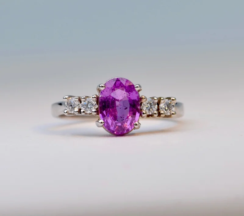 Ladies birthstone shine rings -14K white gold ring with one oval Pink Sapphire and 4 Diamonds