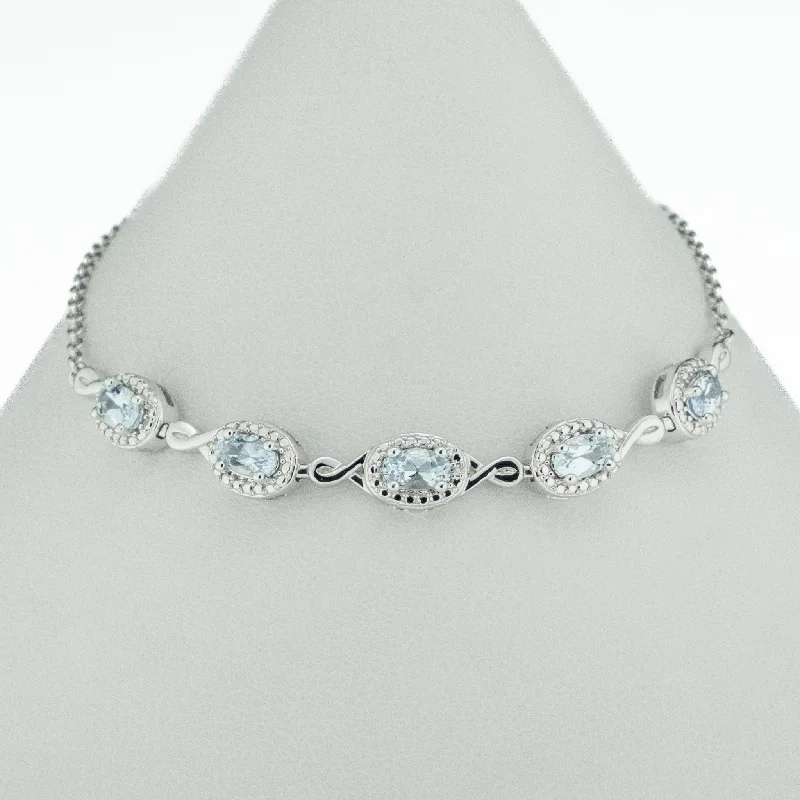 ladies gold bracelets vine patterns -0.97ctw Oval Aquamarine Accented 8" Bracelet in 10K White Gold