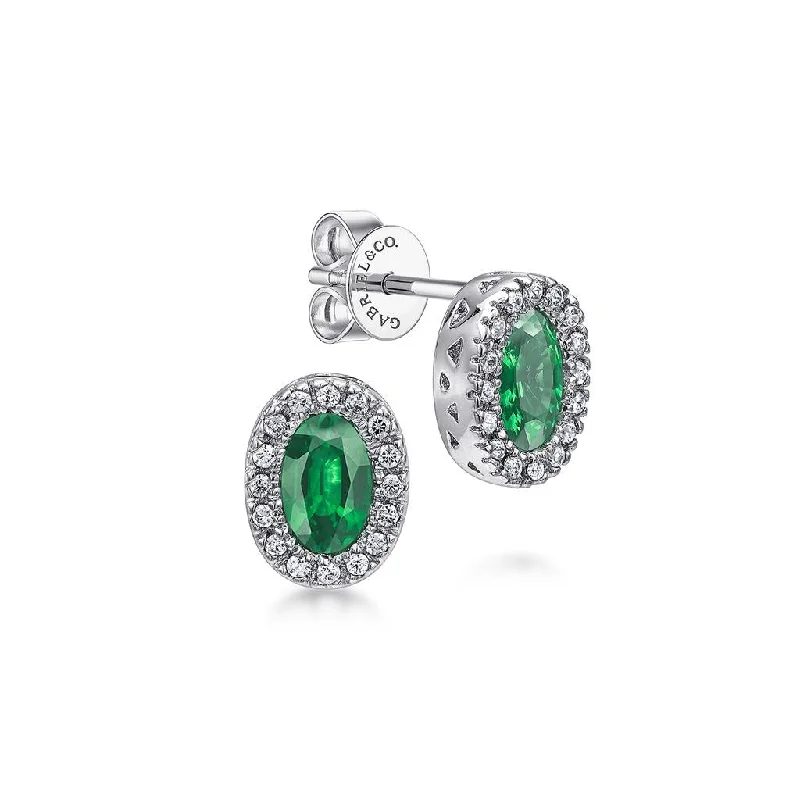 Ladies gem burst earrings -Gabriel & Co. 14k White Gold Oval Emerald and Diamond Halo Stud Earrings - .15cttw