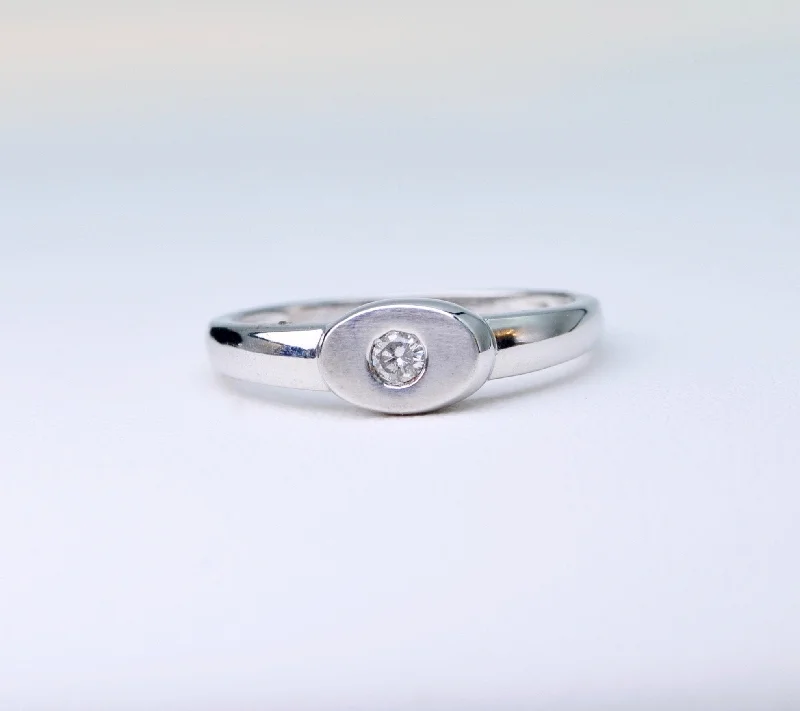 Ladies tiny sparkle rings -18K white gold ring with one small diamond set in an oval surface