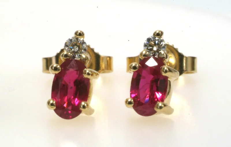 Ladies bold red earrings -Oval Ruby & Diamond Accent Stud Earrings in 14K Gold